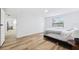 Bright bedroom with ample natural light, light hardwood floors, and ensuite access at 622 Cedar Grove Dr, Brandon, FL 33511