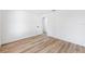 Bedroom with light wood floors and white walls, with two visible doorways at 622 Cedar Grove Dr, Brandon, FL 33511
