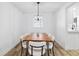 Bright dining room with a live edge table and modern pendant lighting, perfect for elegant dinners and entertaining at 622 Cedar Grove Dr, Brandon, FL 33511