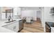 Well-lit kitchen featuring stainless steel appliances, bright white cabinets, and light countertops at 622 Cedar Grove Dr, Brandon, FL 33511
