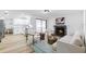 Open-concept living room with bright kitchen, fireplace, and modern furnishings at 622 Cedar Grove Dr, Brandon, FL 33511