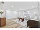 Bright living room featuring natural light, modern decor, light wood floors, and a comfortable seating area at 622 Cedar Grove Dr, Brandon, FL 33511