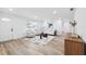 Bright living room featuring natural light, modern decor, light wood floors, and a comfortable seating area at 622 Cedar Grove Dr, Brandon, FL 33511