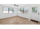 Bright room featuring tile floors, multiple windows, and a white door with a welcome mat at 622 Cedar Grove Dr, Brandon, FL 33511