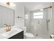 Modern bathroom featuring a marble shower, gold fixtures, and vanity sink at 6240 Keller Dr, Port Richey, FL 34668