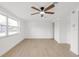 Well-lit bedroom featuring closet and light-colored wood floors at 6240 Keller Dr, Port Richey, FL 34668