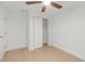 Bedroom featuring a closet with wood floors and a ceiling fan at 6240 Keller Dr, Port Richey, FL 34668