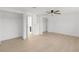 Spacious bedroom featuring two closets and light-colored wood floors at 6240 Keller Dr, Port Richey, FL 34668