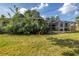 Expansive backyard featuring an enclosed patio area attached to the rear of the property at 6441 27Th N Ave, St Petersburg, FL 33710
