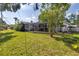 Large backyard featuring a screened-in patio, perfect for enjoying the outdoors at 6441 27Th N Ave, St Petersburg, FL 33710