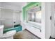 A bathroom featuring a shower and an unusual vanity with a very large mirror at 6441 27Th N Ave, St Petersburg, FL 33710
