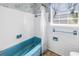 A bathroom featuring a blue tub and a shower curtain at 6441 27Th N Ave, St Petersburg, FL 33710