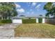 This home boasts a two-car garage, trimmed hedges and a neatly maintained lawn at 6441 27Th N Ave, St Petersburg, FL 33710