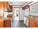 Bright kitchen with a window over the sink, cabinetry, and laminate countertops at 6441 27Th N Ave, St Petersburg, FL 33710
