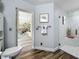 Bright bathroom with walk-in shower, neutral walls and an attached sunroom at 66 Bay Woods Dr, Safety Harbor, FL 34695