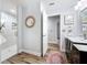 Bathroom view showcasing wood-look tile, a new shower, and a vanity with countertop at 66 Bay Woods Dr, Safety Harbor, FL 34695