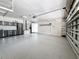 Well-organized garage with epoxy floor and multiple storage cabinets and shelves at 66 Bay Woods Dr, Safety Harbor, FL 34695