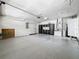 Clean and organized garage space featuring epoxy floors and multiple storage areas at 66 Bay Woods Dr, Safety Harbor, FL 34695