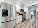 Kitchen showcasing stainless steel appliances, granite counters and view to breakfast nook at 66 Bay Woods Dr, Safety Harbor, FL 34695