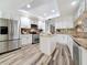 Spacious kitchen featuring an island, stainless steel appliances, and ample cabinet space at 66 Bay Woods Dr, Safety Harbor, FL 34695