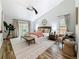 Bright main bedroom with a ceiling fan, neutral decor, and access to the backyard at 66 Bay Woods Dr, Safety Harbor, FL 34695