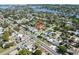 Aerial view of the property with a red arrow pointing to the property, near a lake and the city skyline at 715 39Th Ne Ave, St Petersburg, FL 33703