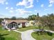 Aerial view of charming home with beautiful landscaping and a long driveway at 715 39Th Ne Ave, St Petersburg, FL 33703