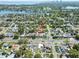 An aerial view of the property in a serene location, nestled among lush greenery and close to the lake at 715 39Th Ne Ave, St Petersburg, FL 33703