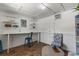 Finished basement with desk, chair, shelving, and hardwood flooring at 715 39Th Ne Ave, St Petersburg, FL 33703