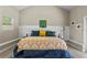 Bright bedroom with vaulted ceiling, featuring stylish decor, a cozy bed, and ample natural light at 715 39Th Ne Ave, St Petersburg, FL 33703