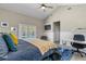 Bright bedroom with workspace that walks out to a stunning pool and patio area at 715 39Th Ne Ave, St Petersburg, FL 33703