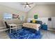 Bedroom showcasing a cozy atmosphere, ceiling fan, desk, and ample natural light at 715 39Th Ne Ave, St Petersburg, FL 33703