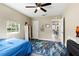 Bedroom with a full bed, white shelving unit, and natural light at 715 39Th Ne Ave, St Petersburg, FL 33703
