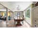 Elegant dining room with large windows, stylish lighting, and open layout at 715 39Th Ne Ave, St Petersburg, FL 33703