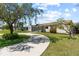 Charming home with mature landscaping, a long driveway and lovely curb appeal at 715 39Th Ne Ave, St Petersburg, FL 33703