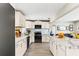 Modern kitchen features stainless appliances, marble countertops, island and wood flooring at 715 39Th Ne Ave, St Petersburg, FL 33703