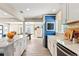 Bright kitchen boasts white cabinets, marble countertops and stainless steel appliances at 715 39Th Ne Ave, St Petersburg, FL 33703