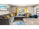 Comfortable living room with lots of natural light, stylish decor and a cozy sectional sofa at 715 39Th Ne Ave, St Petersburg, FL 33703