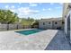 Relaxing pool area featuring brick patio, backyard fence, and sunny skies at 715 39Th Ne Ave, St Petersburg, FL 33703
