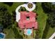 Aerial view showcases the expansive red tile roof and lush landscaping of this luxury estate at 7713 Still Lakes Dr, Odessa, FL 33556