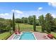 Aerial view of the backyard showing the pool, spa, and fire pit at 7713 Still Lakes Dr, Odessa, FL 33556