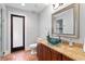 Charming bathroom features a stylish bowl sink, granite counters, and tiled floors at 7713 Still Lakes Dr, Odessa, FL 33556