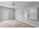 Bedroom featuring carpet, light walls, and access to outdoor at 7713 Still Lakes Dr, Odessa, FL 33556