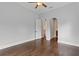 Spacious bedroom featuring hardwood floors, crown molding, neutral paint and an arched doorway at 7713 Still Lakes Dr, Odessa, FL 33556