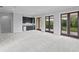 Spacious bonus room features a wet bar and doors that lead to a balcony at 7713 Still Lakes Dr, Odessa, FL 33556