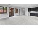 Spacious bonus room featuring plush carpet, wet bar and french doors that lead to a balcony at 7713 Still Lakes Dr, Odessa, FL 33556
