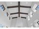 Unique ceiling detail with exposed beams and natural light from clerestory windows at 7713 Still Lakes Dr, Odessa, FL 33556