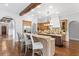 Spacious kitchen featuring two islands, granite countertops, and wood cabinetry at 7713 Still Lakes Dr, Odessa, FL 33556