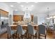 Gourmet kitchen with granite countertops, stainless steel appliances, and an island with bar seating at 7713 Still Lakes Dr, Odessa, FL 33556