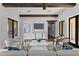 Bright living room showcasing modern decor, recessed lighting, and hardwood floors at 7713 Still Lakes Dr, Odessa, FL 33556